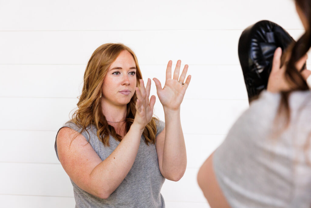 Self-Defense stance demonstrating by We Are Safer Together staff.